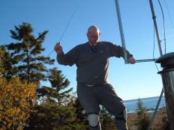Solar PV panel being added to roof of cottage