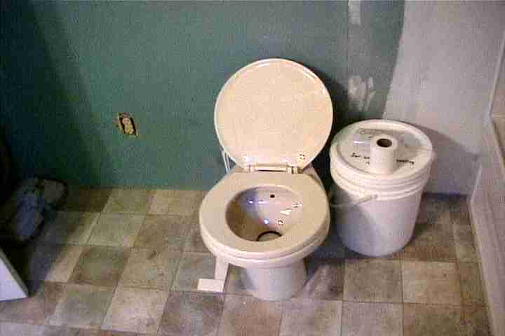 High efficiency flush toilet in Ontario cabin rental on Manitoulin Island, Canada