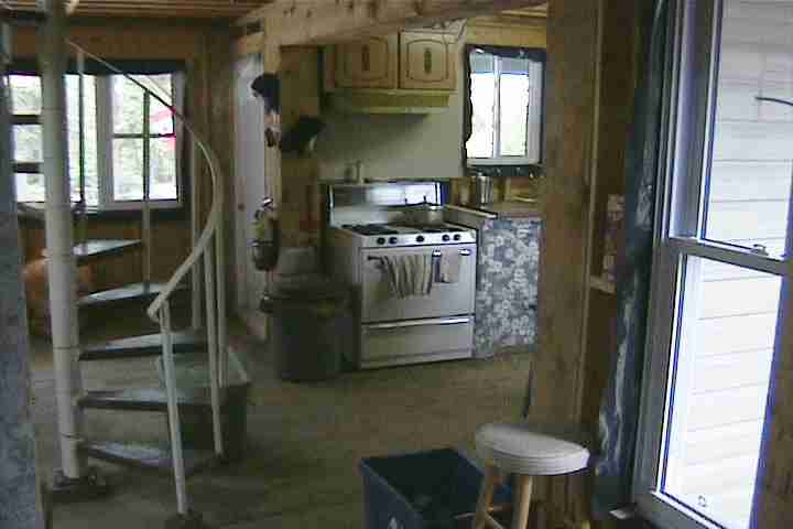 Spiral staircase in main hall of cabin rental on Manitoulin Island, Northern Ontario Canada