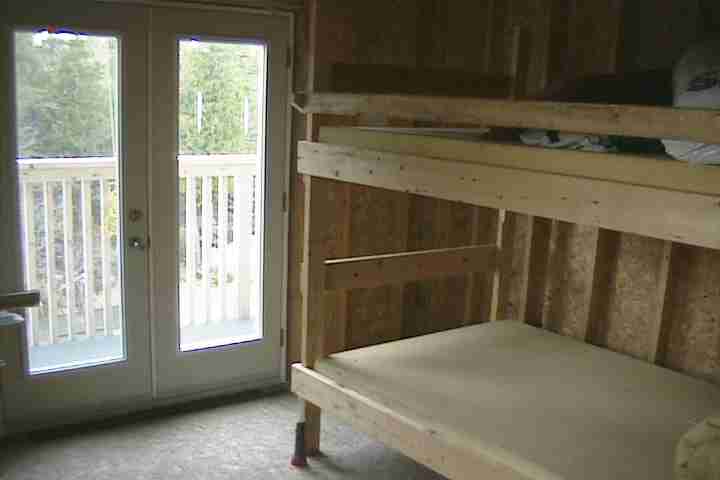 Double bunk beds with 5" thick foam mattress in bear hunting lodge