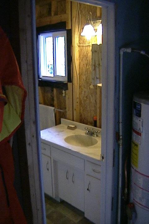 Bathroom sink, mirror, & towel rack in beach rental on Manitoulin Island Northern Ontario Canada