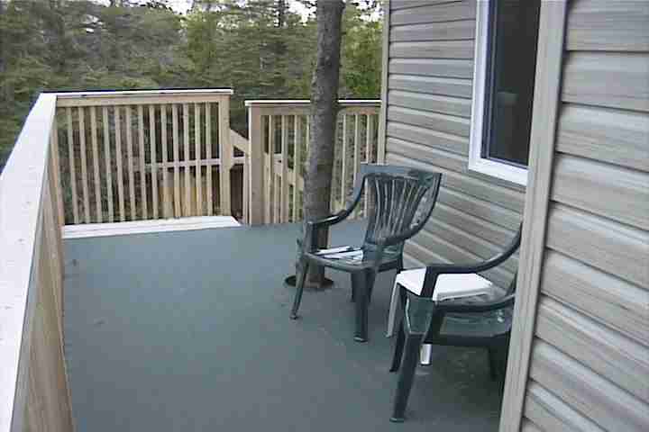 Quiet sitting area on upper deck outside master bedroom of vacation home rental on Manitoulin Island, Ontario Canada