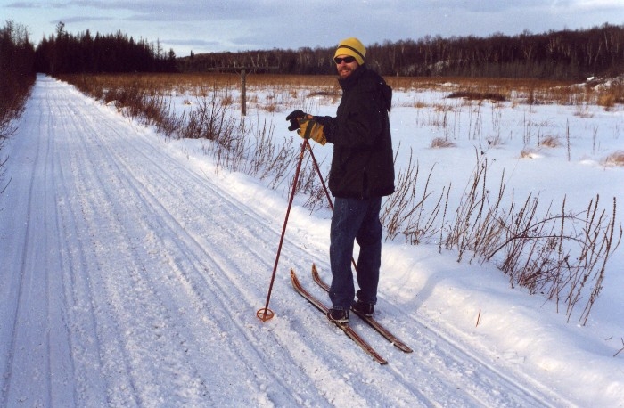 Cross-country skiing along a snow covered country trail, Manitoulin Island, Ontario Canada